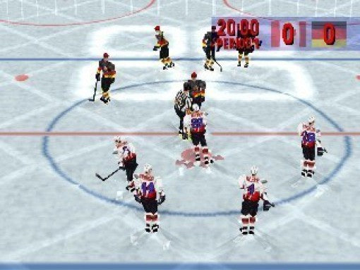 Eine Spielszene zeigt Eishockeyspieler auf dem Eis, die sich zum Bully im Mittelkreis versammeln.