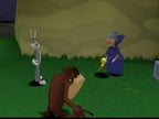 Bugs Bunny, Taz und Granny stehen auf einer grünen Wiese, Granny hält etwas Gelbes in der Hand.