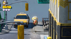 Captain Toad: Treasure Tracker zeigt Toadette neben einem gelben Taxi auf einer Straße.