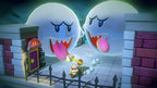 In Captain Toad: Treasure Tracker flieht Toad mit seiner Stirnlampe vor zwei riesigen Buu Huus.