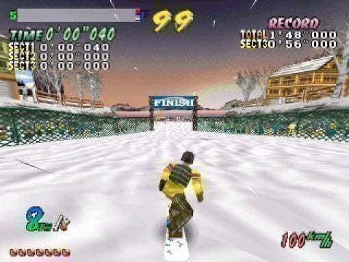 Ein Snowboarder fährt in Cool Boarders 2 auf eine Ziellinie zu, umgeben von verschneiten Häusern.