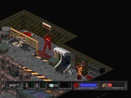 Ein roter Soldat steht in einem isometrischen Raum mit Betten und Computern, unten ist das HUD zu sehen.