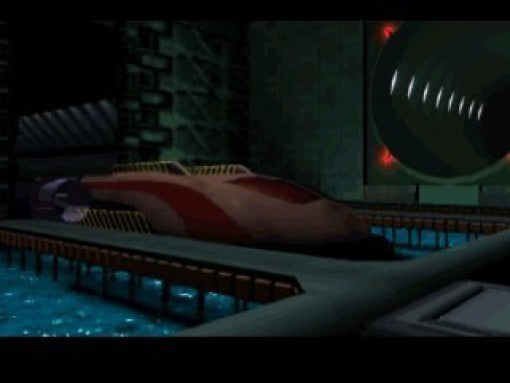 Ein futuristisches, rotes Fahrzeug steht auf einer Plattform in einem dunklen Hangar mit Wasser.