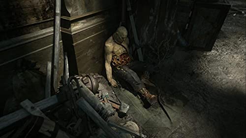 Ein toter, aufgeschnittener Gegner liegt in einem dunklen Dungeon in Dishonored 2.