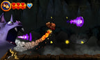 In Donkey Kong: Country Returns 3D greift eine Fledermaus mit violetten Energiestrahlen an.