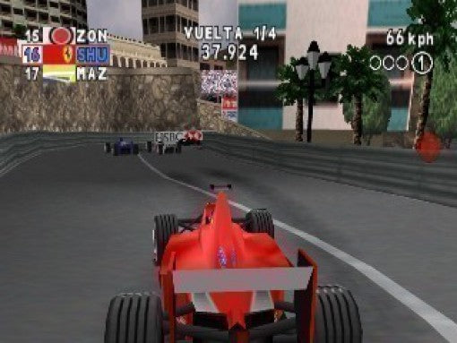 Ein roter Formel-1-Wagen fährt auf einem Stadtkurs durch eine Linkskurve, mit Palmen und Gebäuden am Rand.