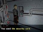 Der blonde Protagonist steht vor einer Wand mit Kabeln und einem Schalter, darunter ein englischer Text.