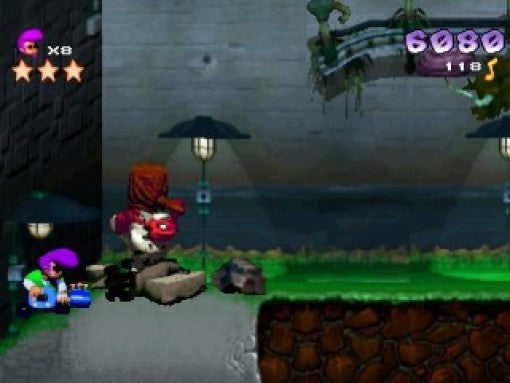 Johnny Bazookatone steht in einer dunklen Gasse neben einem großen, roten Gegner mit Hut und schießt auf ihn.