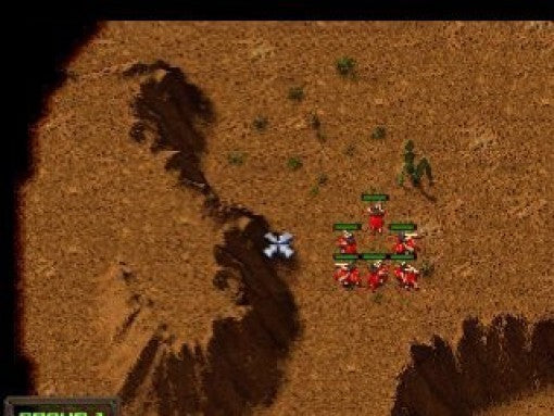 Eine strategische Draufsicht zeigt eine Gruppe roter Einheiten auf einer sandigen Karte. (88 Zeichen).