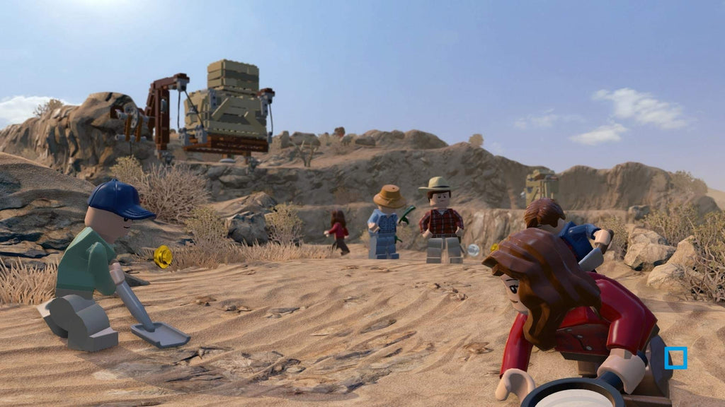 Mehrere LEGO-Figuren suchen in LEGO Jurassic World in einer Wüstenlandschaft nach Spuren.