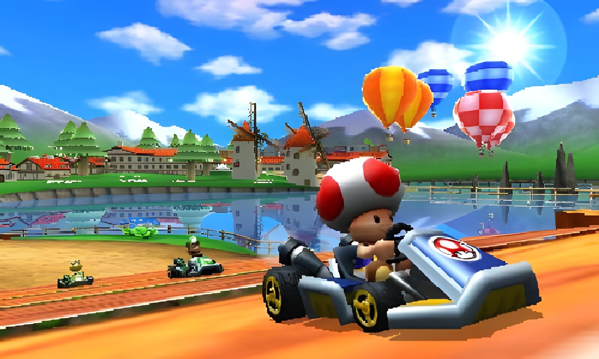 Toad fährt in Mario Kart 7 für Nintendo 3DS an Windmühlen und Heißluftballons vorbei.