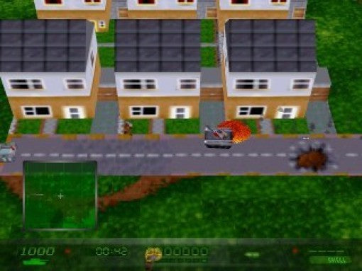 Ein Panzer fährt auf einer Straße vor einer Reihe von Häusern und hinterlässt eine Explosion.