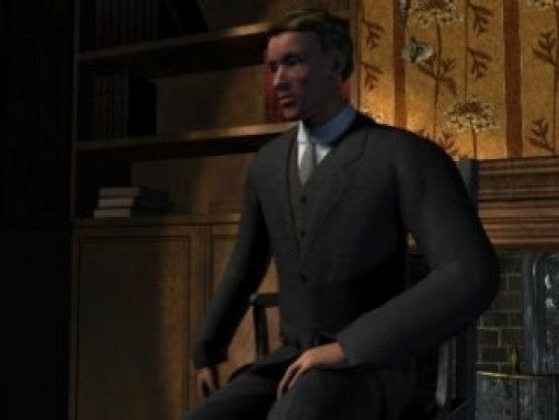 Ein Mann in einem dunklen Anzug und Krawatte sitzt in einem Raum mit Bücherregal.