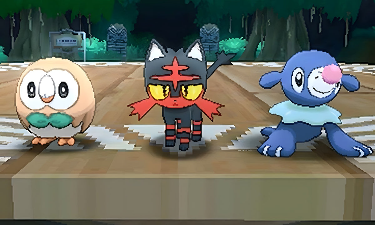 Die drei Starter-Pokémon Rowlet, Litten und Popplio stehen in Pokémon: Sonne / Sun nebeneinander.