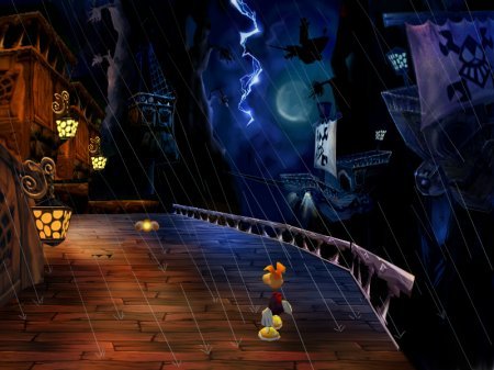 Rayman M für PS2 zeigt Rayman auf einer Holzbrücke bei Nacht, während es regnet und blitzt.