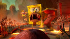 SpongeBob mit offenem Mund und Patrick im Hintergrund in einer roten Höhlenlandschaft.