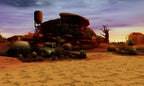 Eine weitere Wüstenlandschaft in Tekken 3D Prime Edition zeigt Felsen, einen Wasserturm und ein Wrack.