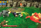 Wario kämpft auf einer grünen Wiese gegen mehrere Gegner, darunter ein graues Kanonentier.